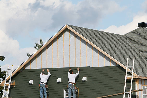 Professional Vinyl Siding technician working in Weston, MA